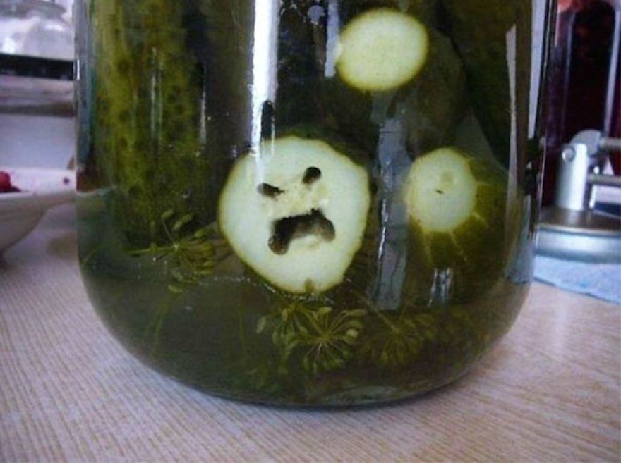 angry shaped pickle slice in a jar