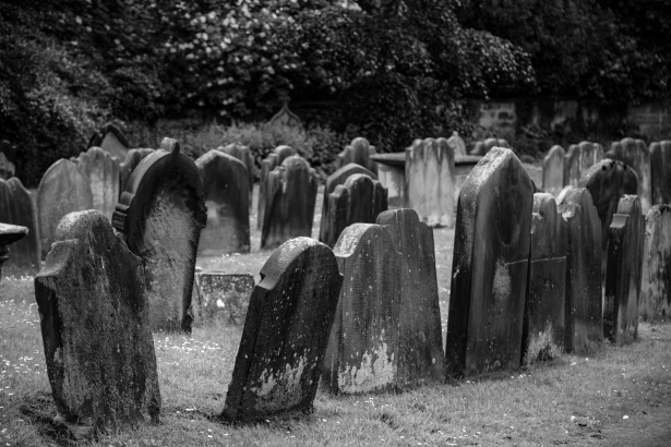 Blurry picture of an old cemetary in black and white.